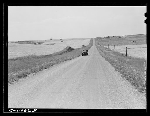Highway through wheat ranches near Williston, North Dakota
