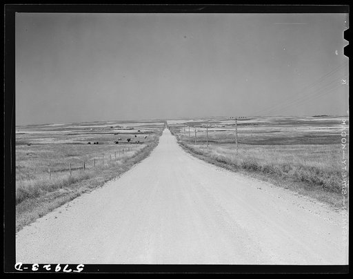 Road across plains near Williston, North Dakota