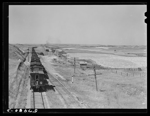 Untitled photo, possibly related to: Freight train going west from Minot, North Dakota, across the plains