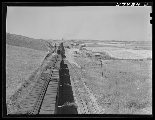Untitled photo, possibly related to: Freight train going west from Minot, North Dakota, across the plains