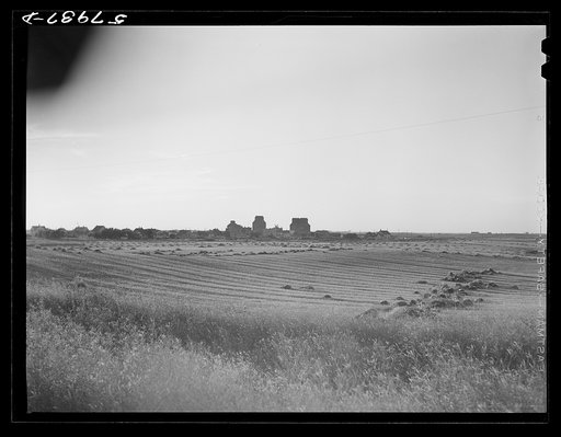 Untitled photo, possibly related to: Grain storage elevators in town in northwestern North Dakota