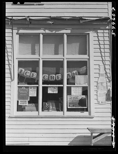 Untitled photo, possibly related to: Window of post office and store. Homestead, Montana