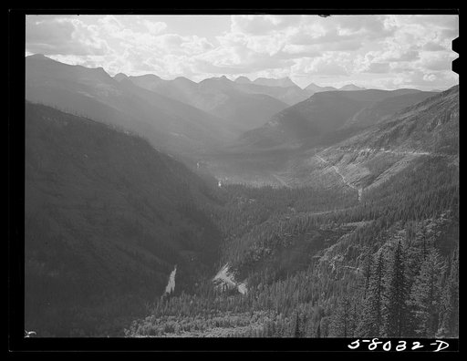 General view of Rocky Mountains west of Continental Divide seen from top of Logan Pass on Going-to-the-Sun highway. Glacier National Park, Montana