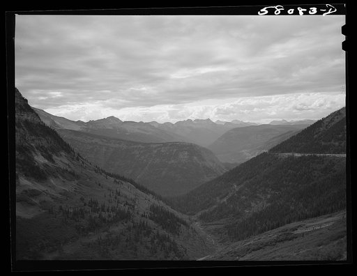 General view of Rocky Mountains west of Continental Divide seen from top of Logan Pass on Going-to-the-Sun highway. Glacier National Park, Montana