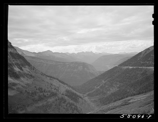 General view of Rocky Mountains west of Continental Divide seen from top of Logan Pass on Going-to-the-Sun highway. Glacier National Park, Montana