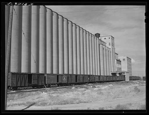 Grain storage, elevators and freight trains. Great Falls, Montana