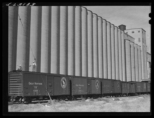 Grain storage, elevators and freight trains. Great Falls, Montana