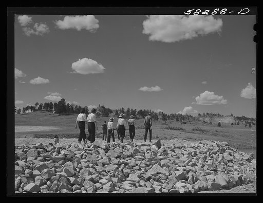 Dudes from Quarter Circle U Ranch seeing the reservoir for cattle on Lyman Brewster's lease. Near Lame Deer, Montana