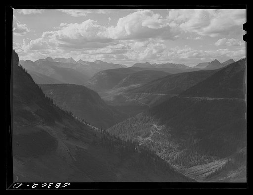 General view of Rocky Mountains west of Continental Divide seen from top of Logan Pass going onto the Sun highway. Glacier Park, Montana