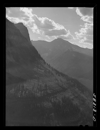 General view of Rocky Mountains west of Continental Divide seen from top of Logan Pass en route to the Sun highway. Glacier National Park, Montana