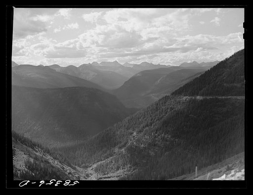 General view of Rocky Mountains at sundown west of Continental Divide seen from top of Logan Pass en route to the Sun highway. Glacier National Park, Montana