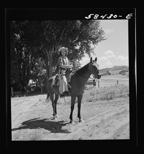 Untitled photo, possibly related to: Dudes saddling their horses at Quarter Circle U Ranch, Brewster-Arnold Ranch Company. Birney, Montana