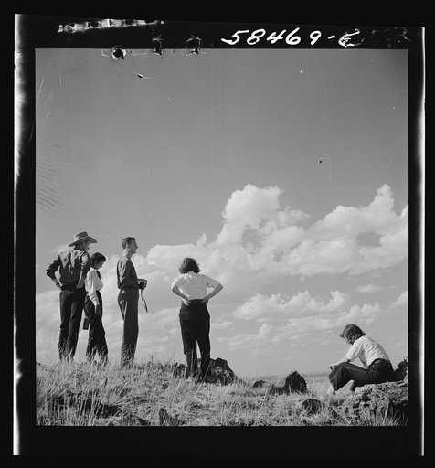 Dudes from Quarter Circle U Ranch looking out over range country from "top of the world" near Lame Deer, Montana