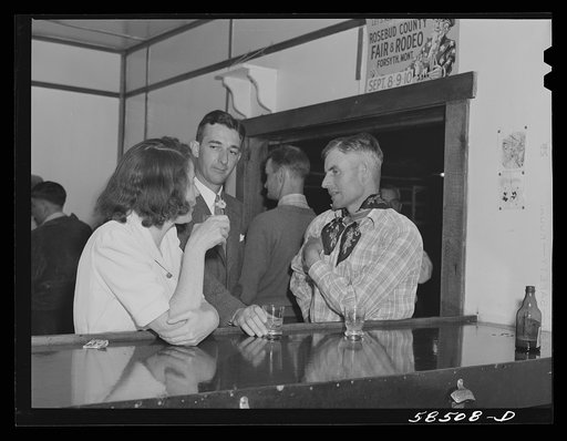 Lyman Brewster talking with an aquaintance at the bar in Birney, Montana