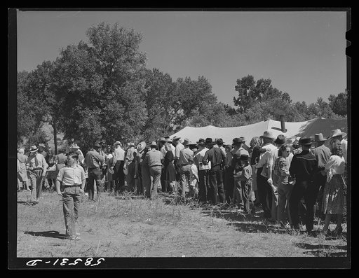 Line of guests waiting to get some barbecued beef at stockmens picnic. Spears Siding, Wyola, Wyoming