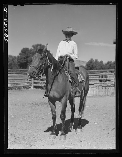 Mrs. Lyman Brewster on one of their ranch horses in the corral. Quarter Circle U, Brewster-Arnold Ranch Company. Birney, Montana