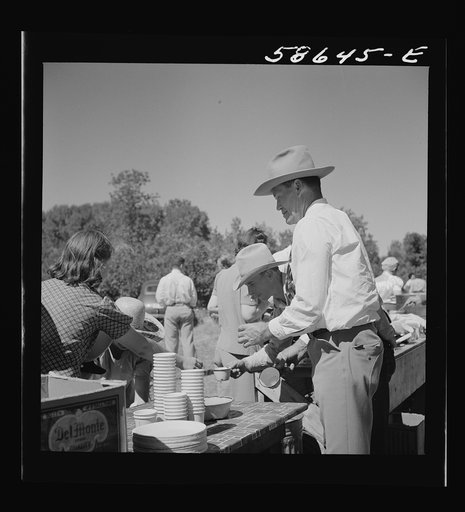 Waiting in line for barbecued beef at the stockmen's picnic and barbecue. Spear's Siding, Wyola, Montana