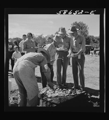 Waiting in line for barbecued beef at the stockmen's picnic and barbecue. Spear's Siding, Wyola, Montana