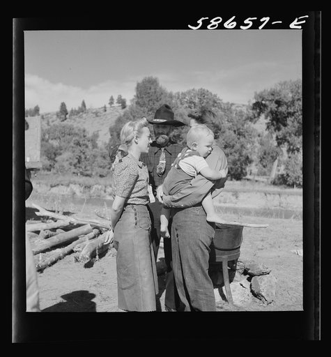 Untitled photo, possibly related to: Spear's Siding, Wyola, Montana. Lyman Brewster of Quarter Circle U Ranch with Sally Rand and her father, Turk Greenough, at a stockmen's picnic and barbecue