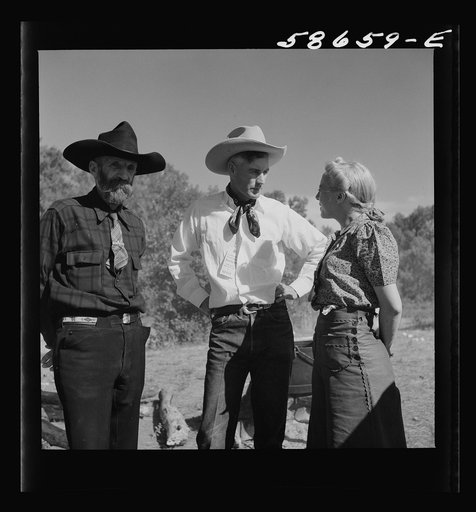 Untitled photo, possibly related to: Spear's Siding, Wyola, Montana. Lyman Brewster of Quarter Circle U Ranch with Sally Rand and her father, Turk Greenough, at a stockmen's picnic and barbecue