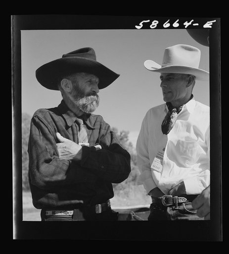 Untitled photo, possibly related to: Lyman Brewster of Quarter Circle U Ranch with Turk Greenough's father (Sally Rand's father-in-law) at a stockmen's picnic and barbecue. Spear's Siding, Wyola, Montana