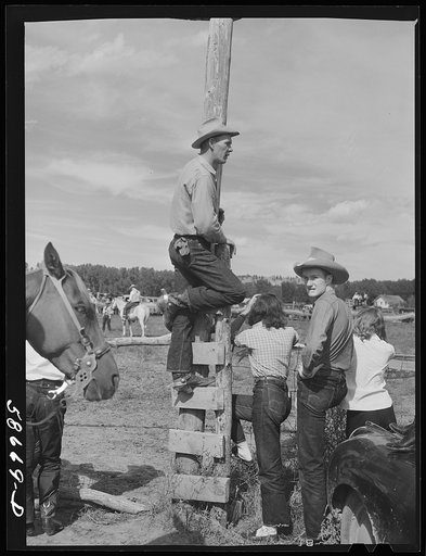 Cowboys and spectators at Ashland rodeo, Montana