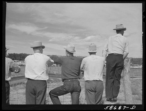 Cowboys and spectators at Ashland rodeo, Montana