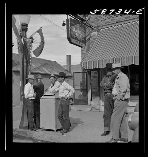 Stockmen on street corner. Sheridan, Wyoming