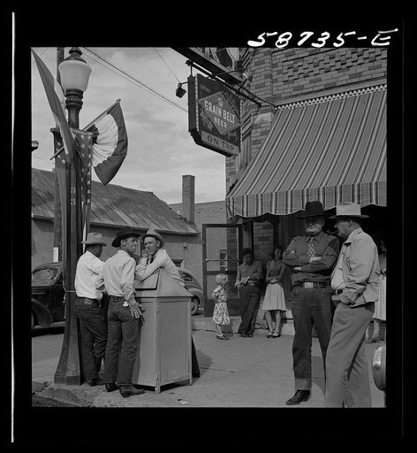 Untitled photo, possibly related to: Stockmen on street corner. Sheridan, Wyoming