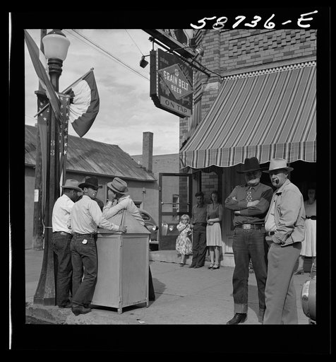 Untitled photo, possibly related to: Stockmen on street corner. Sheridan, Wyoming