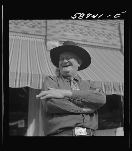 Stockman on street corner. Sheridan, Wyoming