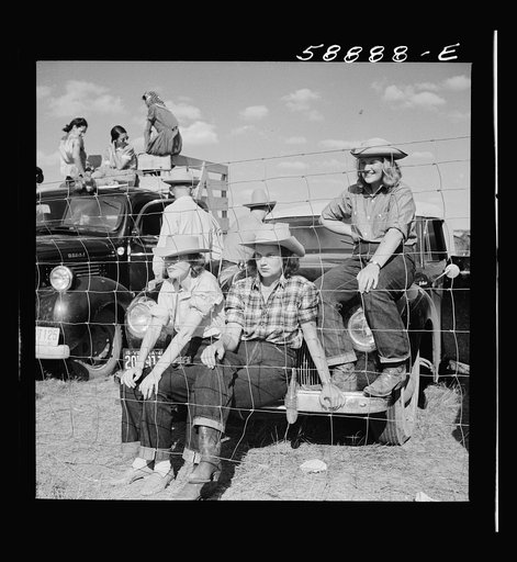 Untitled photo, possibly related to: Crow Agency, Montana. Dudes from the Quarter Circle U Brewster-Arnold Ranch, near Birney, at the Crow Indian fair