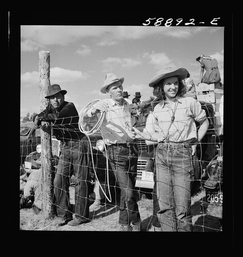 Dudes and cowboy from Quarter Circle U Ranch at Crow Indian fair. Crow Agency, Montana