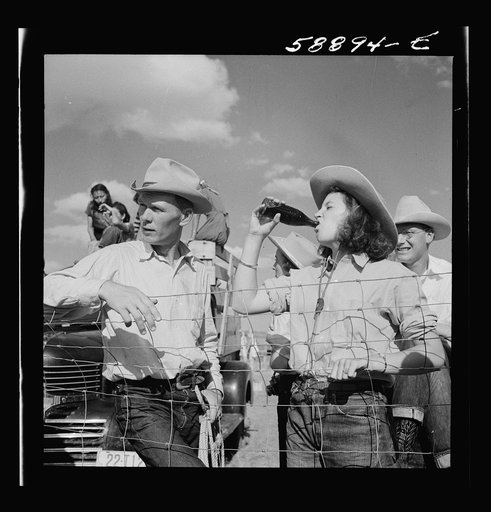 Dudes and cowboy from Quarter Circle U Ranch at Crow Indian fair. Crow Agency, Montana