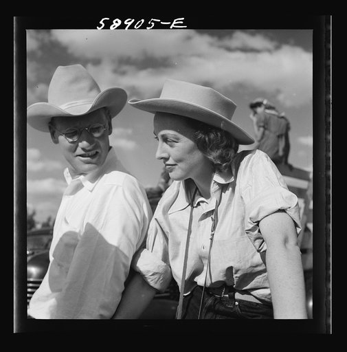 Untitled photo, possibly related to: Dudes from Quarter Circle U Ranch watching the rodeo at the Crow Indian fair. Crow Agency, Montana
