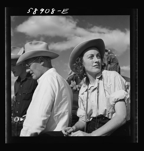 Untitled photo, possibly related to: Dudes from Quarter Circle U Ranch watching the rodeo at the Crow Indian fair. Crow Agency, Montana