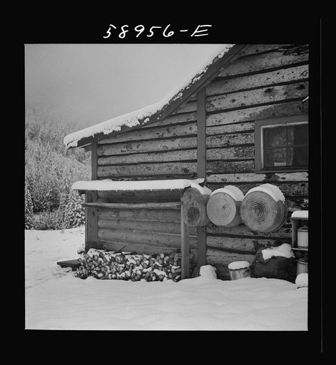 Ranch house after early fall blizzard in mountains near Aspen, Colorado