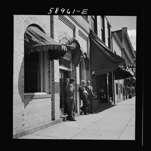 Untitled photo, possibly related to: County judge with mortician and workman in front of mortuary. Main street of Leadville, old mining town, Colorado