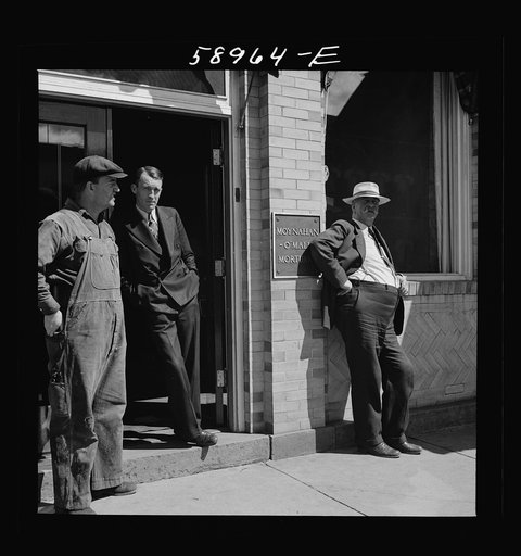 County judge with mortician and workman in front of mortuary. Main street of Leadville, old mining town, Colorado