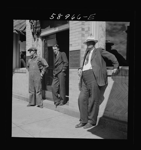 Untitled photo, possibly related to: County judge with mortician and workman in front of mortuary. Main street of Leadville, old mining town, Colorado