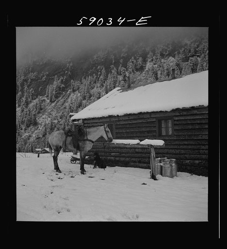 Ranch house after early fall blizzard in mountains near Aspen, Colorado