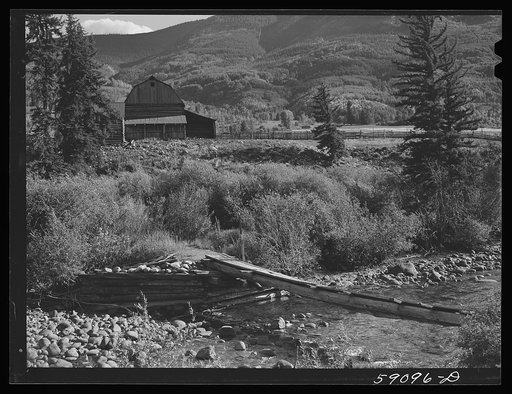 Log bridge across Frying Pan Creek from the road to the ranch house. Near Meredith, Colorado