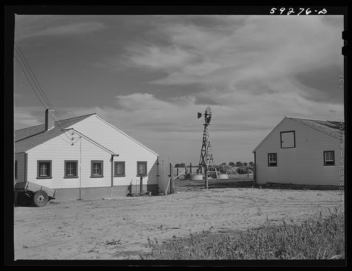New dairy barn. FSA (Farm Security Administration) cooperative enterprise on the Scottsbluff Farmsteads. FSA project. North Platte River Valley, Nebraska