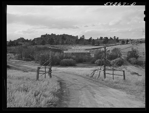 Gate entrance to Bar ED dude ranch. Buford, Wyoming