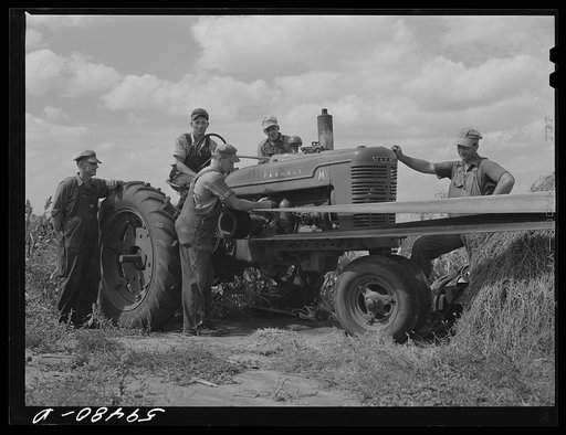 George Leaver, president; Don Shinaut, treasurer; Russell Smith, director; Henry Wollen and Jay Rowell, board of directors of Two River Non-Stock Cooperative, a FSA (Farm Security Administration) co-op, looking at demonstration of Farmall "M" Tractor. Waterloo, Nebraska