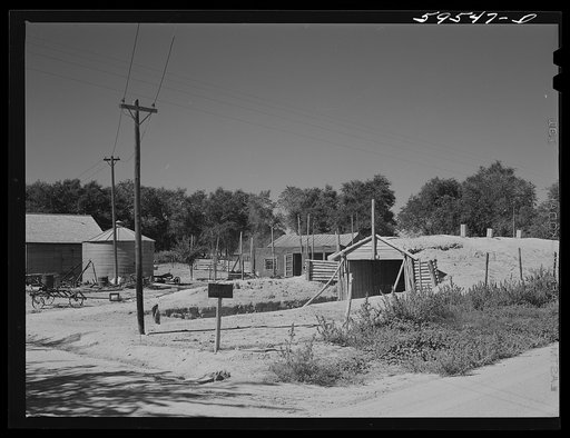 Untitled photo, possibly related to: Farm buildings and potato storage house. At Mitchell, Nebraska
