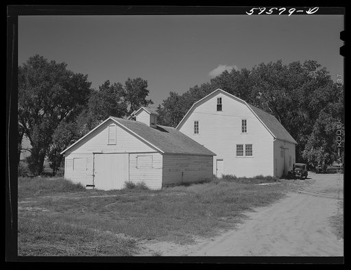 Barn and equipment shed at Two Rivers Non-Stock Cooperative, a FSA (Farm Security Administration) co-op. Waterloo, Nebraska