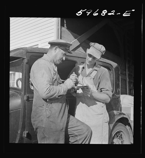 Henry Harringer, in charge of purchasing and marketing enterprise, buying oil and supplies. Two Rivers Non-Stock Cooperative Company, FSA (Farm Security Administration) co-op. Waterloo, Nebraska