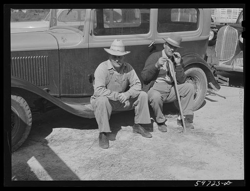 Untitled photo, possibly related to: Men outside the Union Livestock Commission Company during an auction sale. Gering, Nebraska