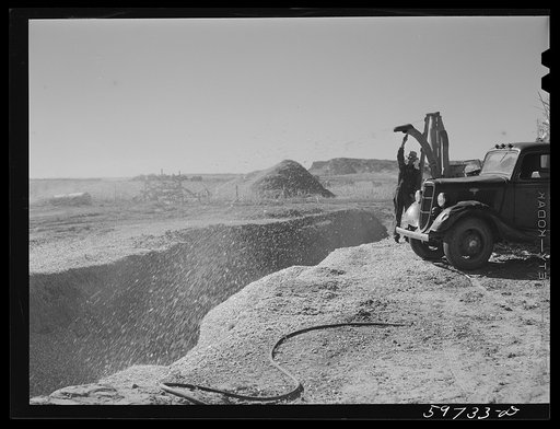 Filling the trench silo on Scottsbluff Farmsteads, FSA (Farm Security Administration) project. Scottsbluff, Nebraska